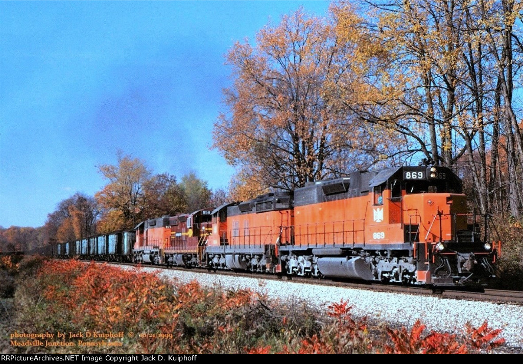 B&LE, Bessemer and Lake Erie SD38AC 869- SD18 854- SD-M 858 ex-DM&IR 191>319- SD38-2 878, is northbound with a loaded coal train at Meadville, JCT. Pennsylvania. October 21, 1999. 